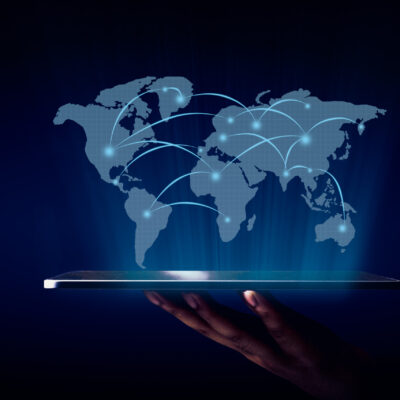 World map hologram with global network showing from the technology tablet over the virtualize screen of world map and business graphic background